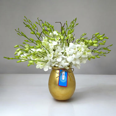White Dendrobium Orchids in Gold Ceramic Vase
